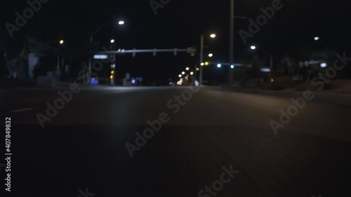 Speeding Car Driving At Night. Camera Low To The Ground Shot.