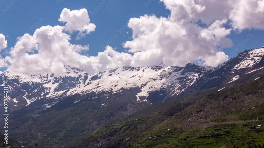 Time Lapse of Thick White Clouds crawling over snow capped glacier and Different layers of Barren and Green Himalaya Mountains in Ladakh Region Time Lapse of Thick White Clouds crawling over snow capped glacier and Different layers of Barren and Green Himalaya Mountains in Ladakh Region