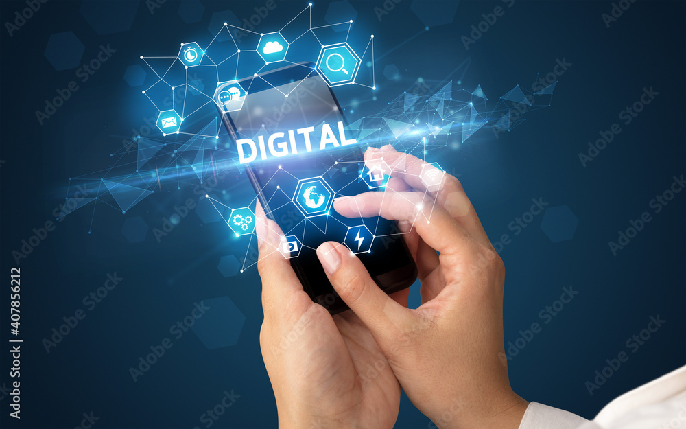 Fototapeta premium Female hand holding smartphone with DIGITAL inscription, modern technology concept