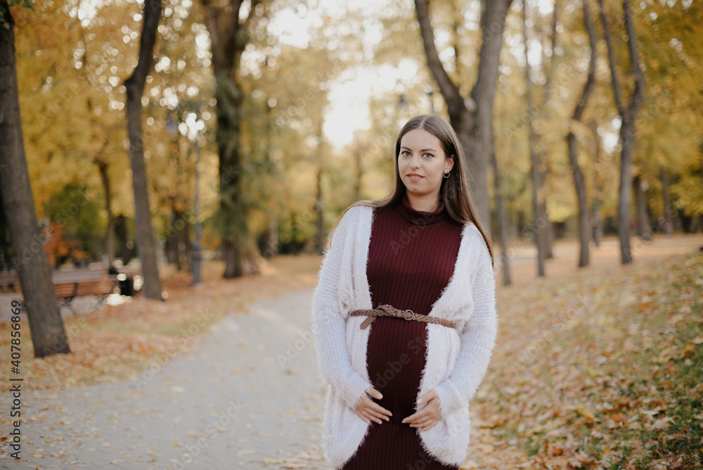 Young beautiful pregnant woman in city park Young beautiful pregnant woman in city park