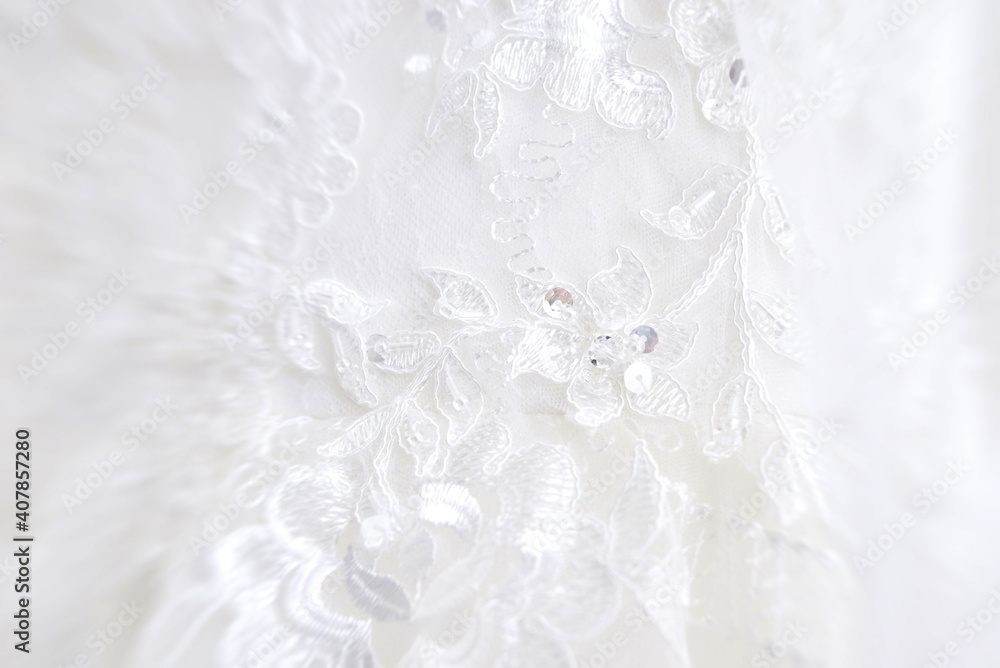 the texture of a wedding dress, embroidered with beads, rhinestones and sequins. the texture of a wedding dress, embroidered with beads, rhinestones and sequins.
