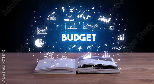BUDGET inscription coming out from an open book, business concept