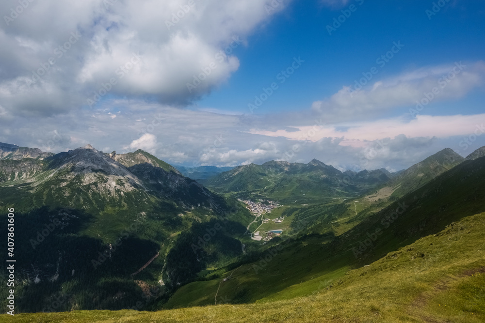 mountain landscape with view to a village in the valley mountain landscape with view to a village in the valley