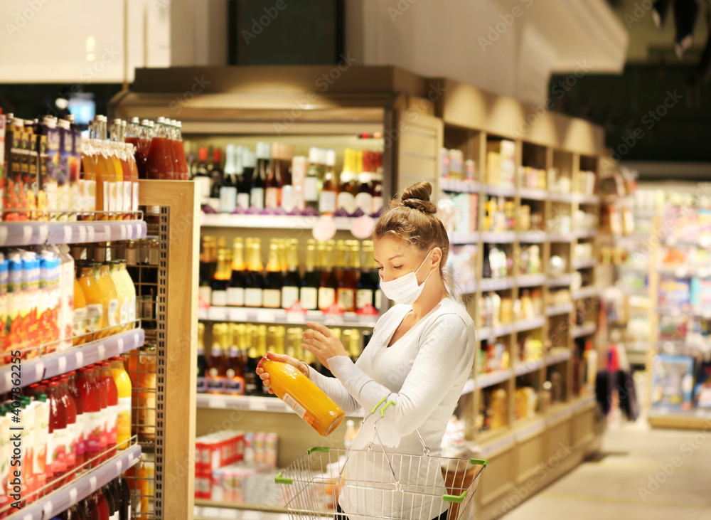 supermarket shopping, face mask and gloves,Woman choosing a dairy products at supermarket