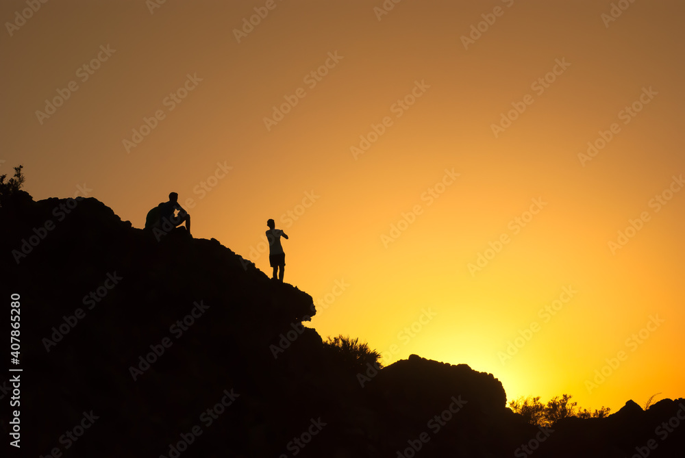 group of boys capture the sunset