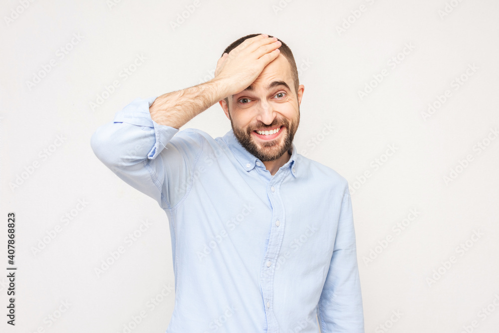 Puzzled bearded man, white background, copy space, toned Puzzled bearded man, white background, copy space, toned