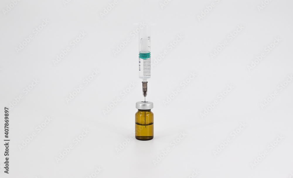 Syringe and vaccine in a bottle Syringe and vaccine in a bottle