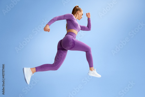 Fotografie, Tablou Fitness woman jumping and running, working out