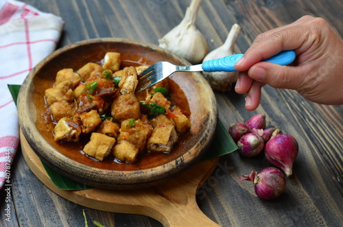 tahu gejrot or gejrot tofu, traditional food from west java indonesia photo