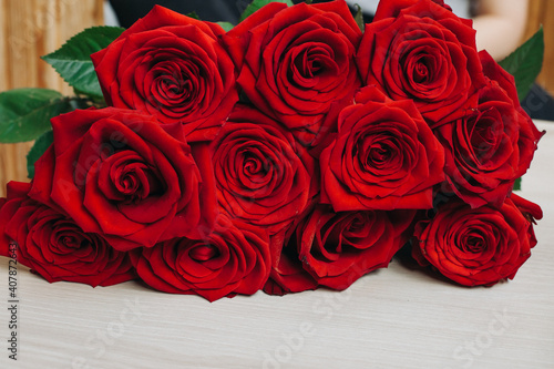 Red roses on wooden board  Valentines Day background