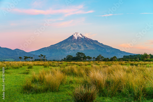 sunset at cone volcano mount taranaki, new zealand