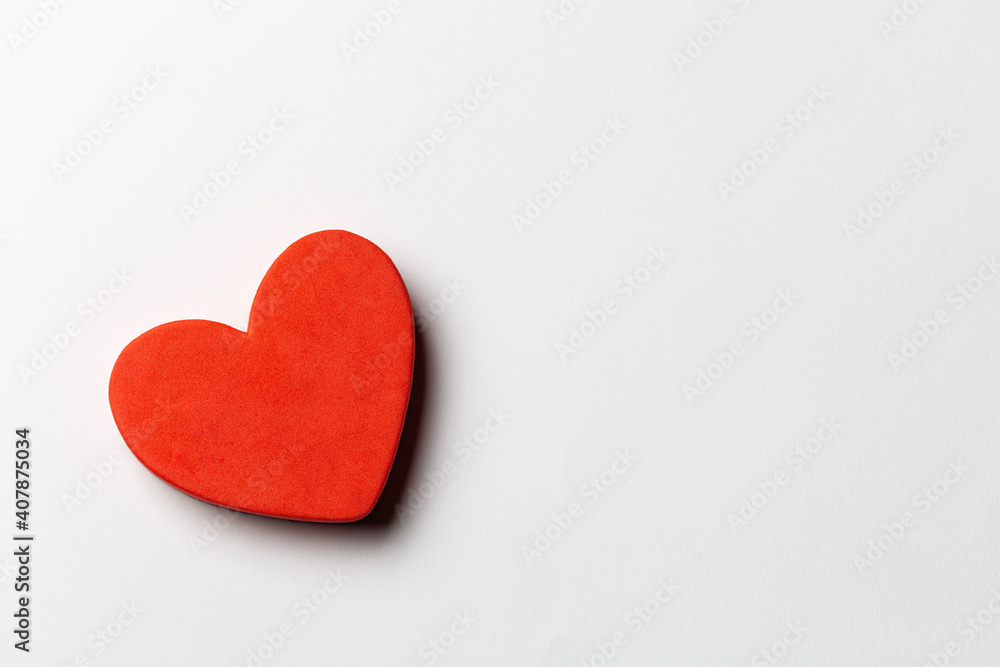 Red heart shapes over white paper background