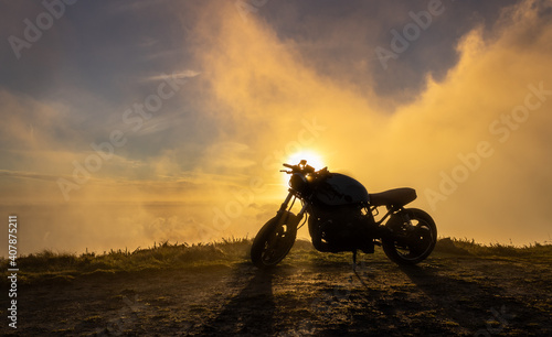 Motorbike in the sunset, Azores, Sao Miguel island, silhouette.
