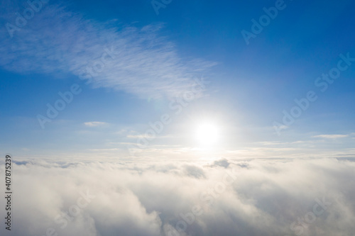 Aerial view white clouds in blue sky. Aerial top view cloudscape. Texture of clouds. View from above. Clouds texture background. Panorama clouds texture