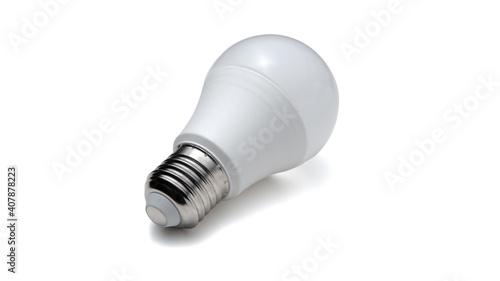 LED lamp with E27 screw base isolated on white background. Close-up photo of single object. Home energy saving concept. photo