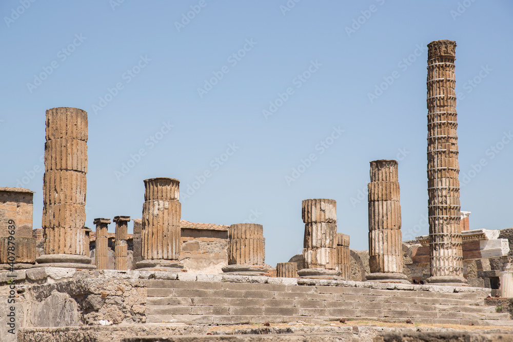 Fototapeta premium View of the columns in the foro of Pompeii's remains, the ancient Roman city.