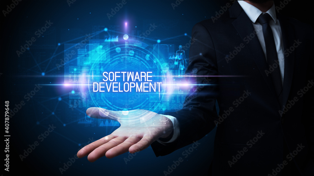 Man hand holding SOFTWARE DEVELOPMENT inscription, technology concept Man hand holding SOFTWARE DEVELOPMENT inscription, technology concept