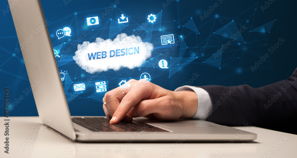 Businessman working on laptop with WEB DESIGN inscription, modern technology concept Businessman working on laptop with WEB DESIGN inscription, modern technology concept