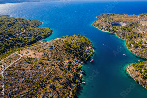 Sailing boats in quiet bay near village Milna on island Brac in Croatia. Aerial drone view in august 2020