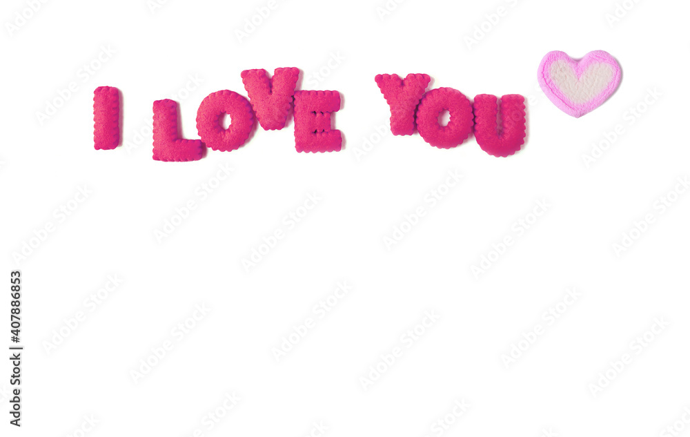 The word I LOVE YOU spelled with hot pink alphabet cookies and pastel pink marshmallow candy on white background The word I LOVE YOU spelled with hot pink alphabet cookies and pastel pink marshmallow candy on white background