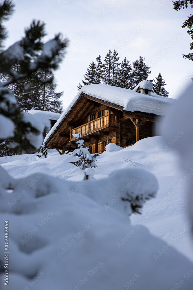 Snow covered cabin in the alps during winter Snow covered cabin in the alps during winter