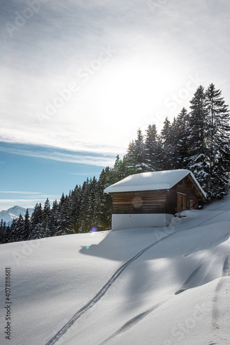 Snow covered cabin in de the alps