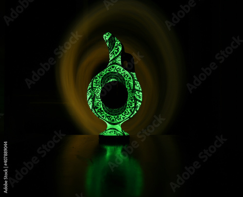 Ancient Turkish Wine jug, made with phosphorescent colours, glowing in dark photo