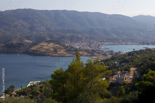 View from the mountain to a small town and nature on the island of Poros. Greece. Panorama.
