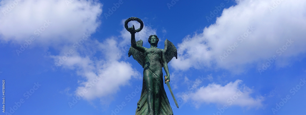 Fototapeta premium Ultra wide photo from famous National Resistance Monument statue in port of Syros island, Ermoupoli, Cyclades, Greece