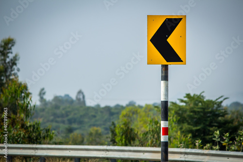 View of the road sign indicating a curvy road ahead
