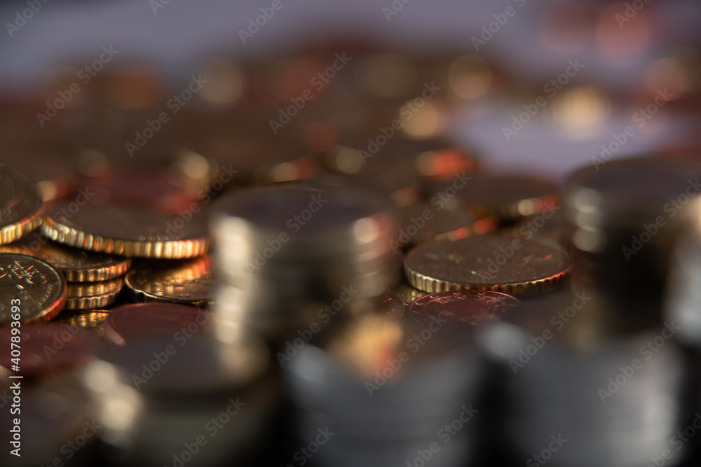Pile of Coins out of focus and different coins in the background in Focus. Shallow depth of field Pile of Coins out of focus and different coins in the background in Focus. Shallow depth of field