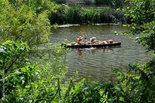Travelers on a kayak in the upper reaches of the Lahn River, in Germany, near Wetzlar.