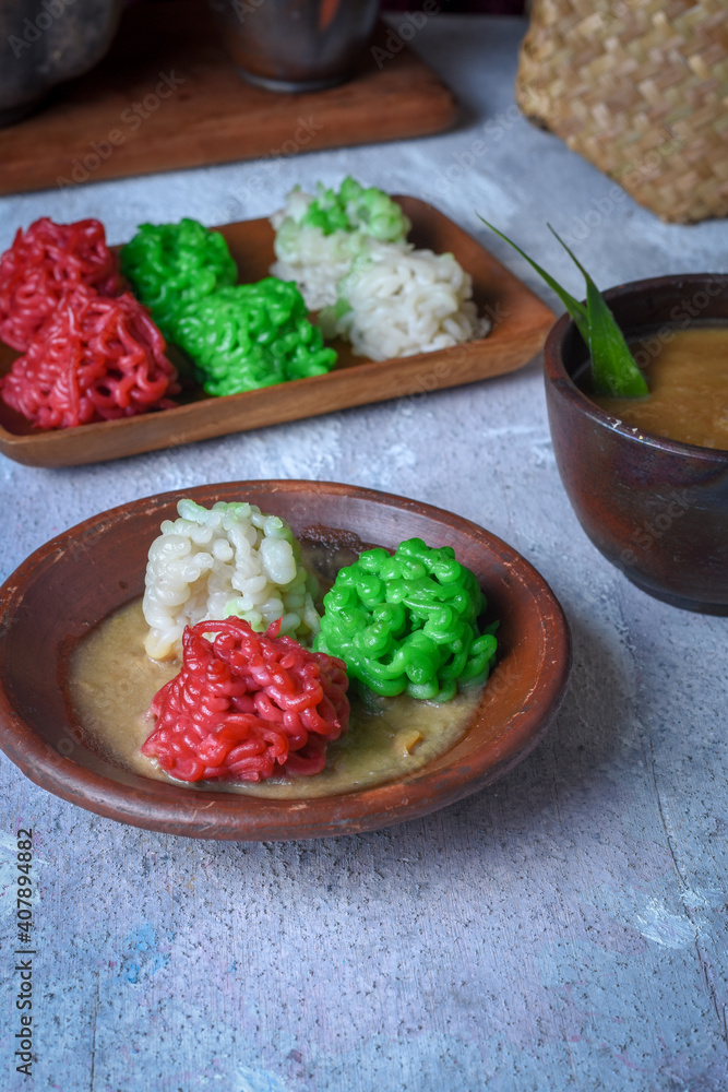 Putu Mayang. Traditional Javanese snack of rice flour strands curled up into a ball; served with coconut milk and palm sugar