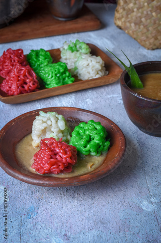 Putu Mayang. Traditional Javanese snack of rice flour strands curled up into a ball; served with coconut milk and palm sugar