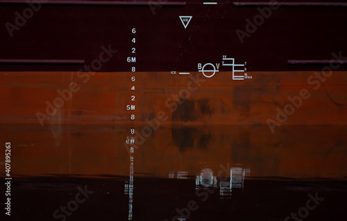 Photography Plimsol line and draught lines on the steel hull of a large cargo ship