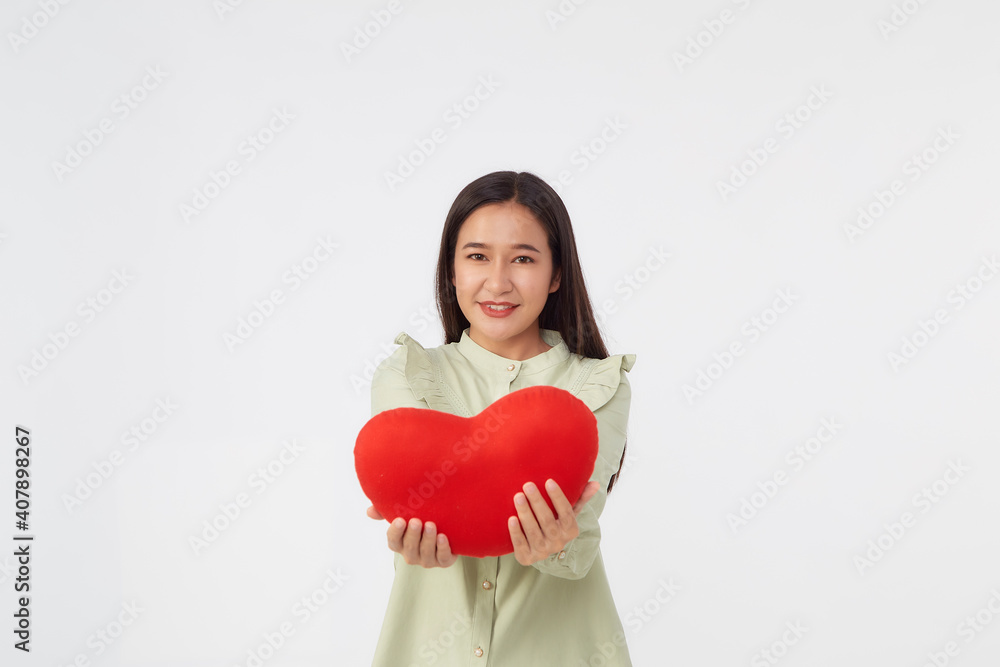 young attractive woman holding a red heart young attractive woman holding a red heart