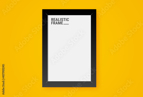 Realistic vertical picture frame isolated on yellow wall background. Blank picture frame template. Empty photo frame mockup.