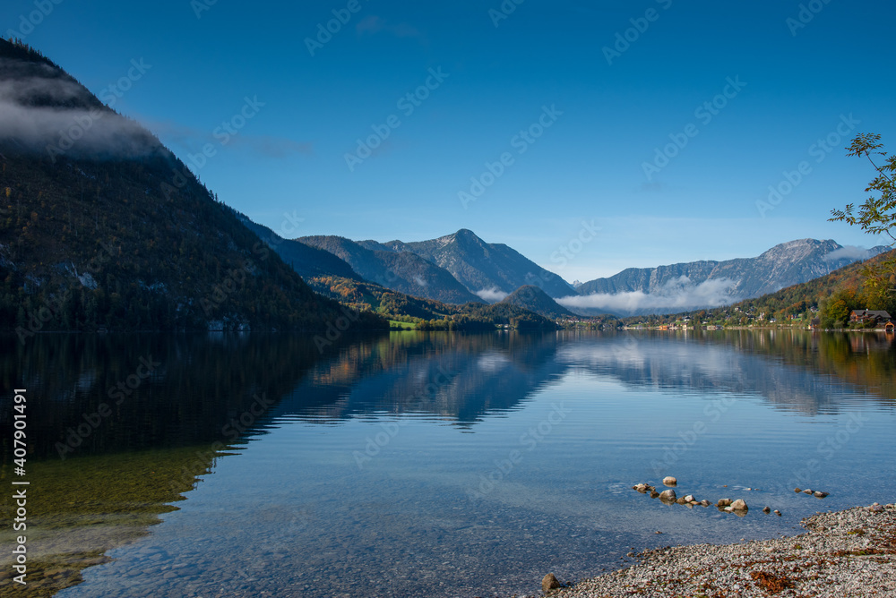 Autumn morning with patches of fog on the lake Grundlsee, Styria, Austria. Autumn morning with patches of fog on the lake Grundlsee, Styria, Austria.