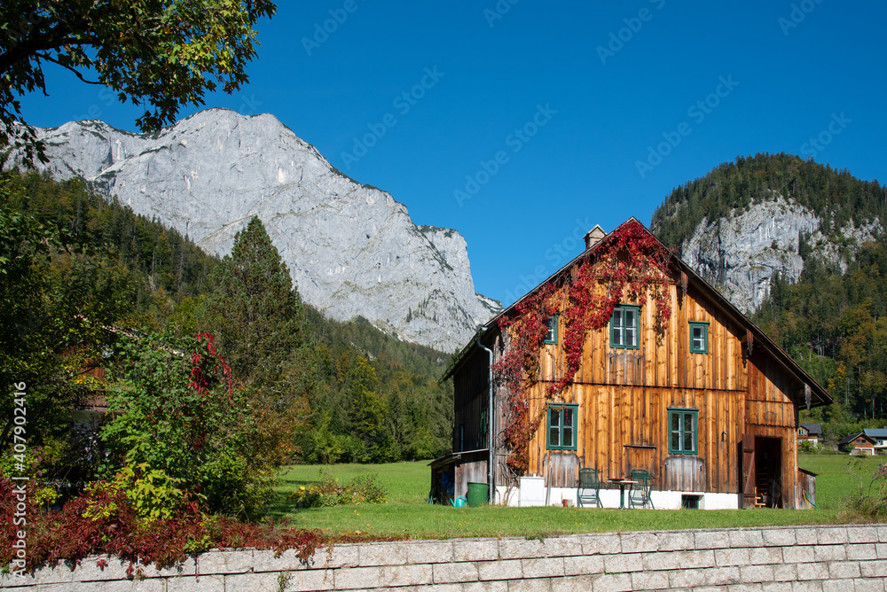 Rural country house with mountains in the background, Grundlsee, Styria, Austria. Rural country house with mountains in the background, Grundlsee, Styria, Austria.