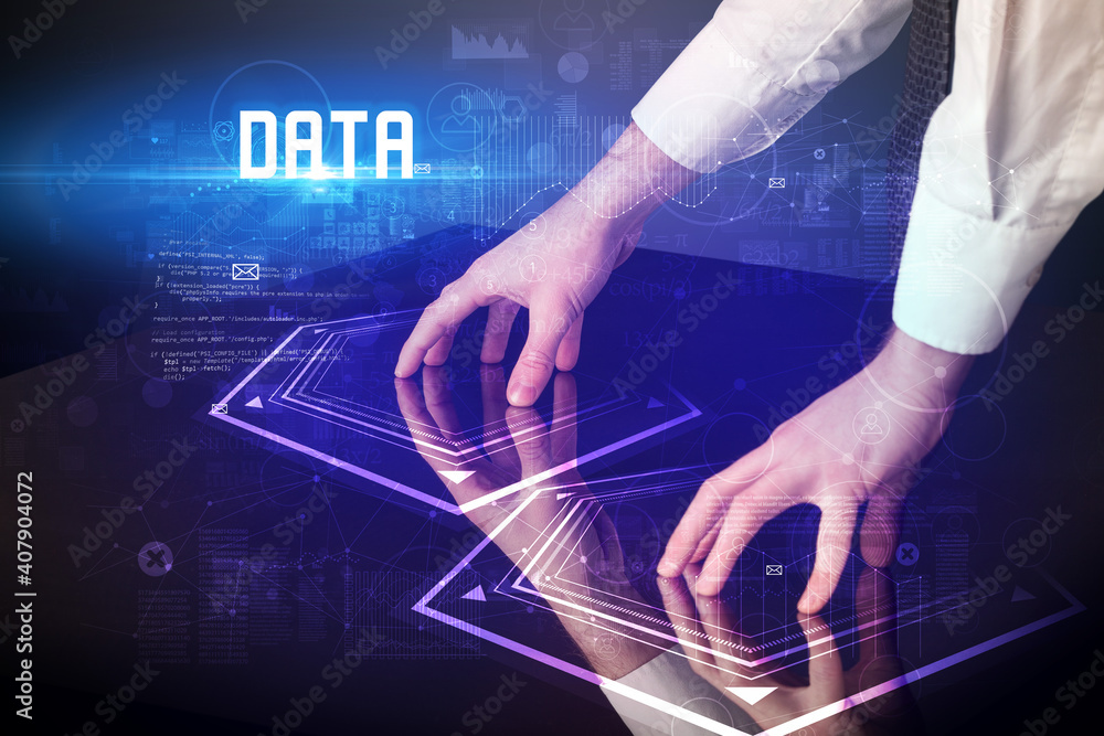 Hand touching digital table with DATA inscription, new age security concept Hand touching digital table with DATA inscription, new age security concept