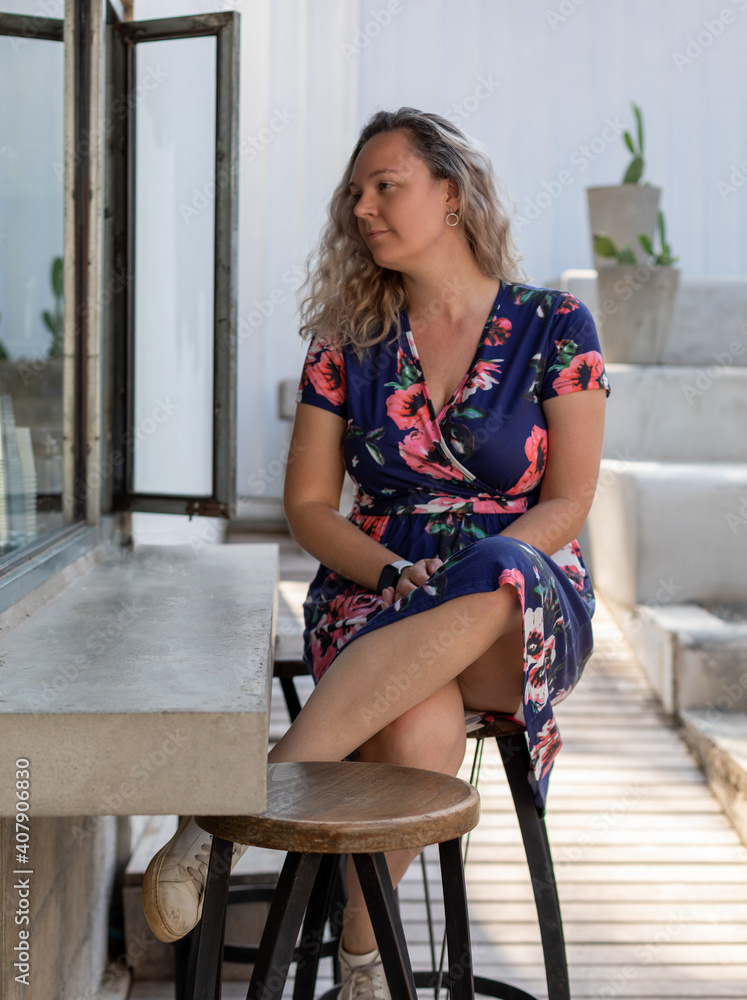 Fototapeta premium woman sitting on a chair