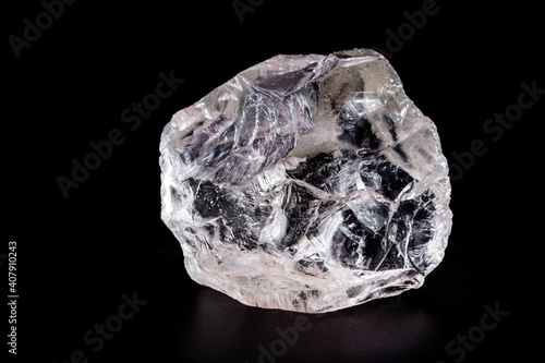 rough diamond, crystal in an allotropic form of carbon, uncut gemstone, concept of luxury or wealth photo