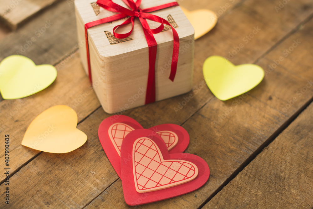 Image of Valentine's day, symbols of love, gift box on a background of wooden planks. 2 Image of Valentine's day, symbols of love, gift box on a background of wooden planks. 2