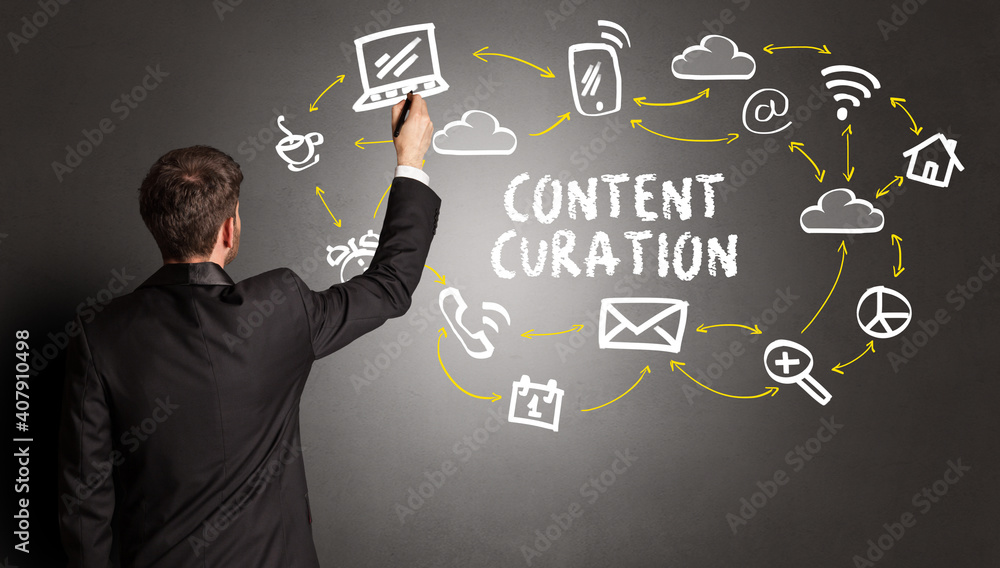 businessman drawing social media icons with CONTENT CURATION inscription, new media concept