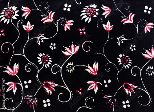 Elegant silk fabric with white and red fantasy flowers and curls on a black background, textile background image