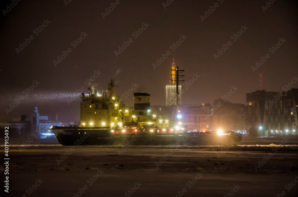 January 2021- Arkhangelsk. The Dikson icebreaker against the background of the city of Arkhangelsk. Russia, Arkhangelsk region 