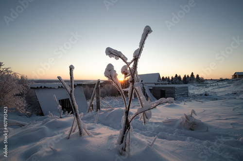 Abandoned Russian houses against the backdrop of a winter landscape  photo