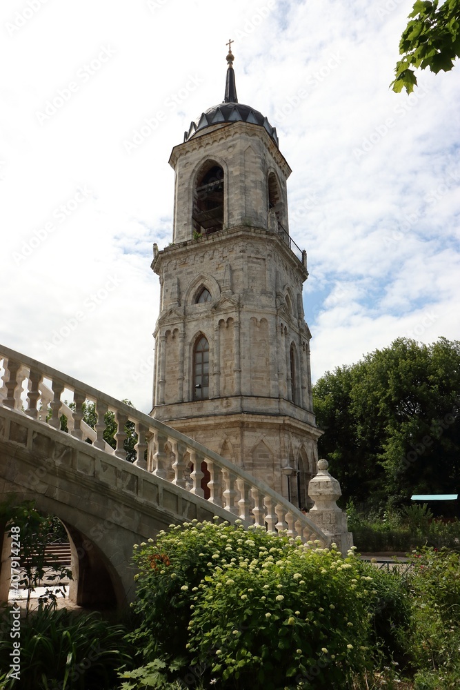 The bell tower of the Vladimir Church in the pseudo-Gothic style in the village of Bykovo, Moscow region, Russia