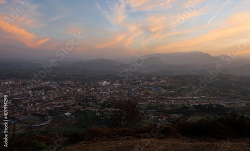 Panorama sunset view of Oviedo city town from Monte Naranco Sagrado Corazon de Jesus statue viewpoint Asturias Spain photo