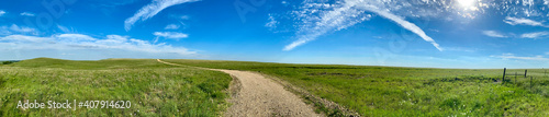 panorama panoramic of green pasture countryside with blue sky and white clouds 